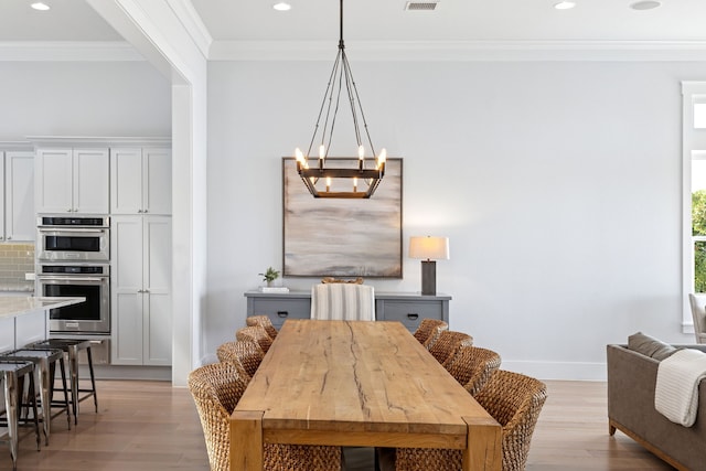 13270 Waterside Dr, Malakoff, TX 75148 - dining area with light wood-style floors, crown molding, a chandelier, recessed lighting, and baseboards