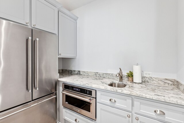 13270 Waterside Dr, Malakoff, TX 75148 - kitchen with appliances with stainless steel finishes, a sink, and white cabinets