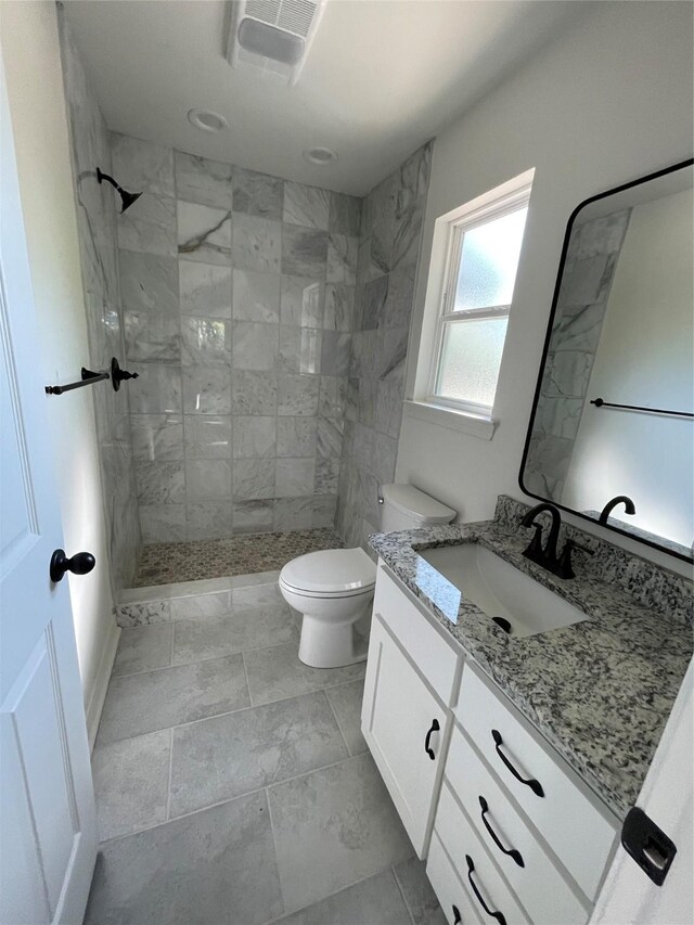 240 Wells St, Emory, TX 75440 - full bath with a tile shower, vanity, and toilet