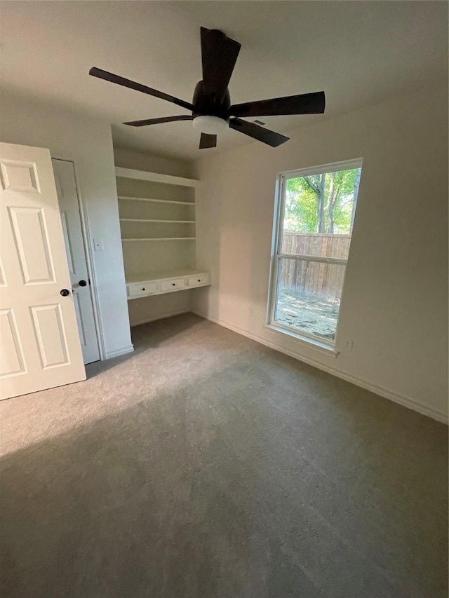 240 Wells St, Emory, TX 75440 - unfurnished bedroom with carpet flooring, baseboards, and a ceiling fan