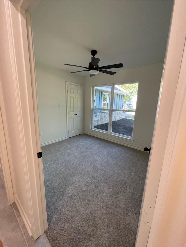 240 Wells St, Emory, TX 75440 - empty room featuring light carpet, baseboards, and a ceiling fan