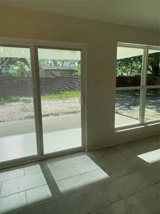 240 Wells St, Emory, TX 75440 - doorway to outside with tile patterned flooring and healthy amount of natural light