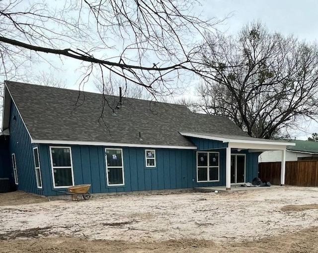 240 Wells St, Emory, TX 75440 - rear view of house featuring roof with shingles, central air condition unit, and board and batten siding