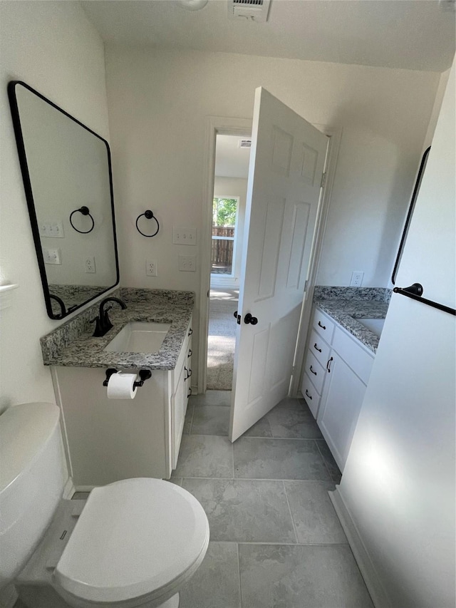 240 Wells St, Emory, TX 75440 - bathroom with toilet and vanity