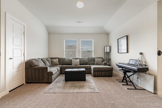 carpeted living area featuring visible vents and vaulted ceiling