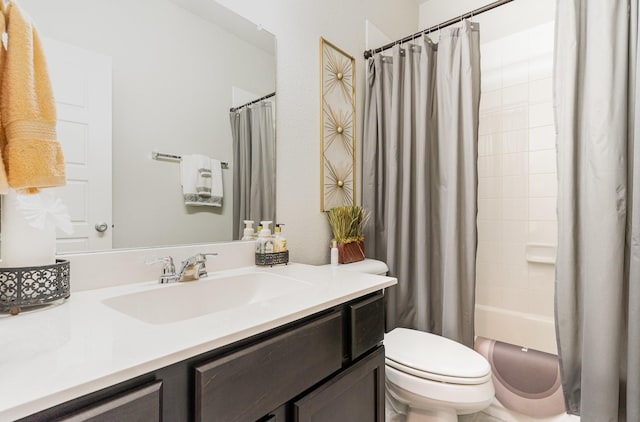 full bathroom featuring vanity, toilet, and shower / tub combo with curtain