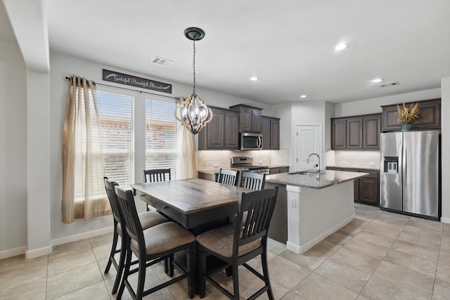 9100 Pearfield Rd, Fort Worth, TX 76179 - dining area featuring baseboards, visible vents, recessed lighting, and an inviting chandelier