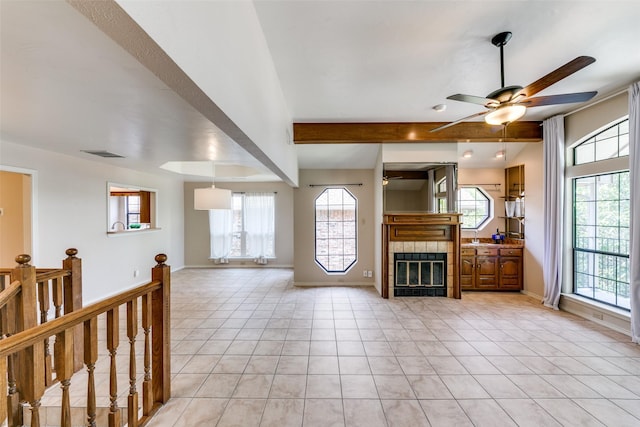 5915 Volunteer Pl, Rockwall, TX 75032 - living room featuring beamed ceiling, a ceiling fan, plenty of natural light, baseboards, and light tile patterned floors