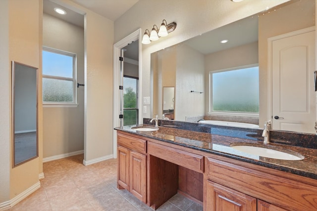 1240 Park Xing, Grand Prairie, TX 75104 - full bath featuring plenty of natural light, double vanity, baseboards, and tile patterned flooring