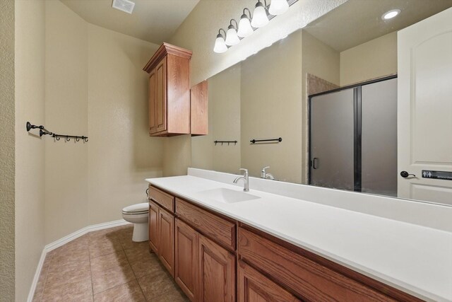 1240 Park Xing, Grand Prairie, TX 75104 - full bath featuring baseboards, toilet, a stall shower, vanity, and tile patterned flooring