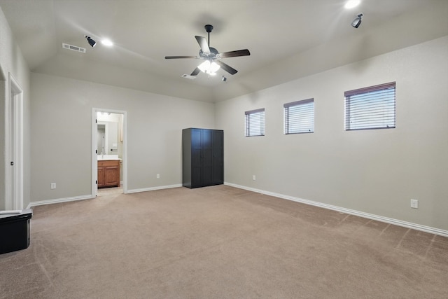 1240 Park Xing, Grand Prairie, TX 75104 - unfurnished bedroom with light carpet, baseboards, connected bathroom, and ceiling fan