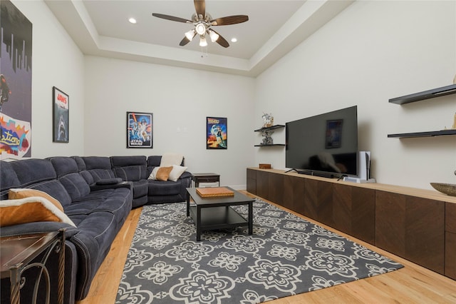 749 Lazy Brooke Dr, Rockwall, TX 75087 - living area with a tray ceiling, wood finished floors, a ceiling fan, and recessed lighting