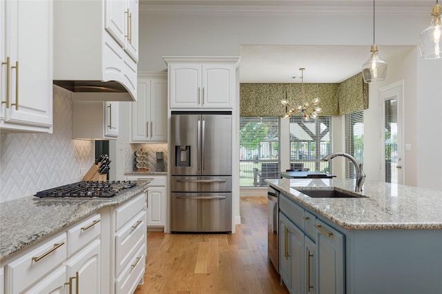 749 Lazy Brooke Dr, Rockwall, TX 75087 - kitchen featuring white cabinets, light wood-type flooring, appliances with stainless steel finishes, and a sink