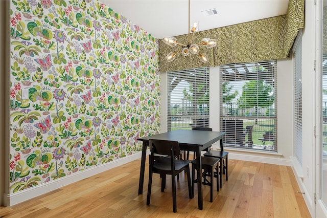 749 Lazy Brooke Dr, Rockwall, TX 75087 - dining room featuring a chandelier, wood finished floors, visible vents, and baseboards