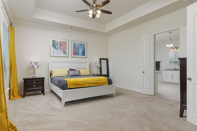 749 Lazy Brooke Dr, Rockwall, TX 75087 - bedroom featuring a raised ceiling, ornamental molding, ensuite bath, baseboards, and light colored carpet