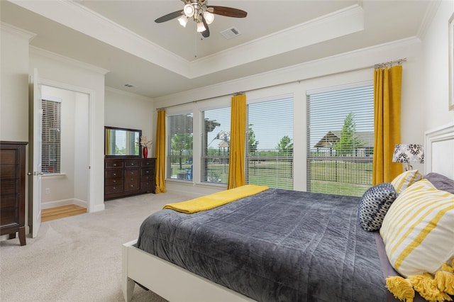 749 Lazy Brooke Dr, Rockwall, TX 75087 - bedroom with light carpet, visible vents, a raised ceiling, and crown molding