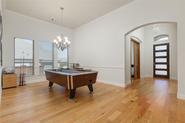 749 Lazy Brooke Dr, Rockwall, TX 75087 - playroom with arched walkways, an inviting chandelier, crown molding, and light wood-style floors