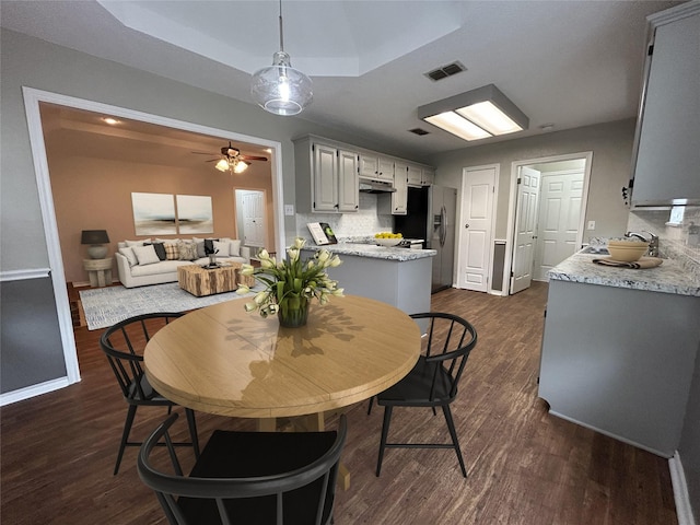 3308 Omega Dr, Tyler, TX 75701 - dining space featuring dark wood-style floors and ceiling fan