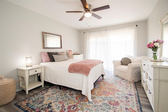 11114 Valleydale Dr Unit D, Dallas, TX 75230 - bedroom with wood finished floors and ceiling fan