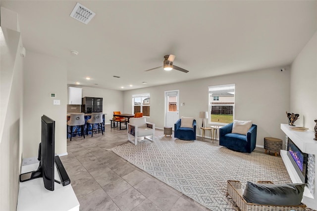 1718 Ackerly Dr, Forney, TX 75126 - living area with a ceiling fan, baseboards, and light tile patterned floors