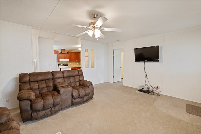 living room featuring light colored carpet and a ceiling fan