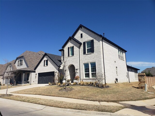 1645 Lilac Ln, Celina, TX 75009 - view of front of property featuring concrete driveway and brick siding
