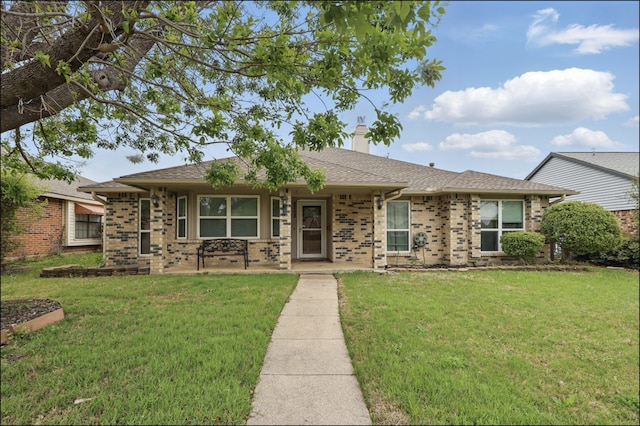 single story home featuring a shingled roof, a front lawn, and a chimney