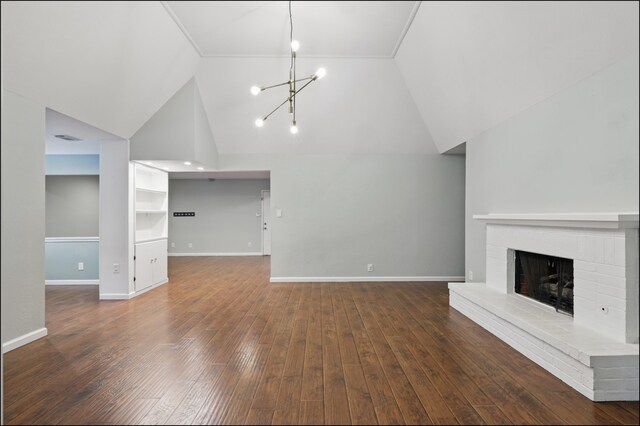 unfurnished living room featuring baseboards, a notable chandelier, high vaulted ceiling, a fireplace, and wood-type flooring