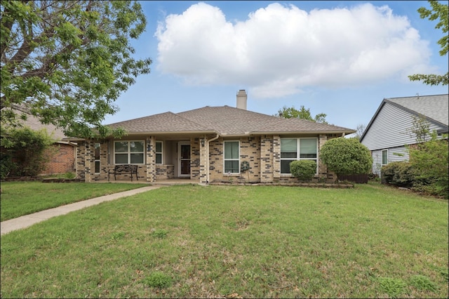 ranch-style house with a front lawn, a chimney, and covered porch