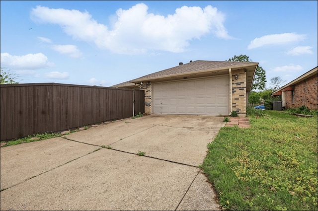garage with cooling unit and fence