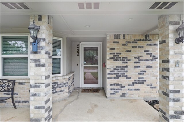 doorway to property featuring visible vents