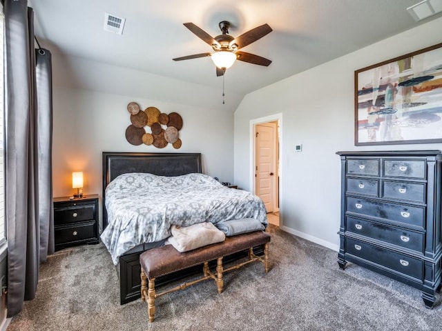 carpeted bedroom with lofted ceiling, visible vents, a ceiling fan, and baseboards
