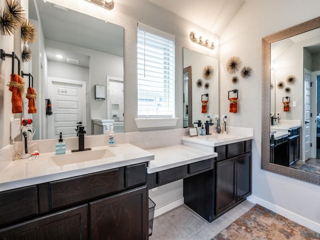 full bathroom with baseboards, vanity, and tile patterned floors