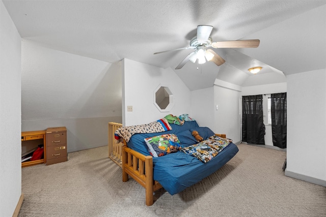 carpeted bedroom with baseboards, lofted ceiling, ceiling fan, and a textured ceiling