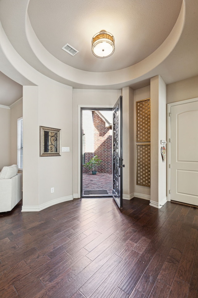 4513 Cherokee Dr, Mckinney, TX 75072 - foyer featuring visible vents, a tray ceiling, baseboards, and dark wood finished floors