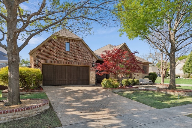 4513 Cherokee Dr, Mckinney, TX 75072 - traditional-style house with a garage, a front yard, brick siding, and driveway
