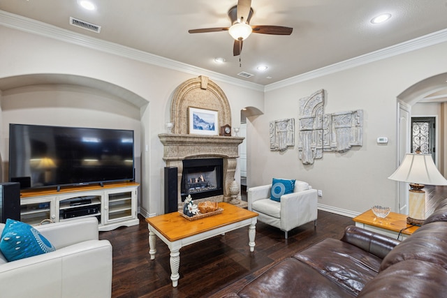 4513 Cherokee Dr, Mckinney, TX 75072 - living room featuring a fireplace, visible vents, ceiling fan, arched walkways, and wood-type flooring