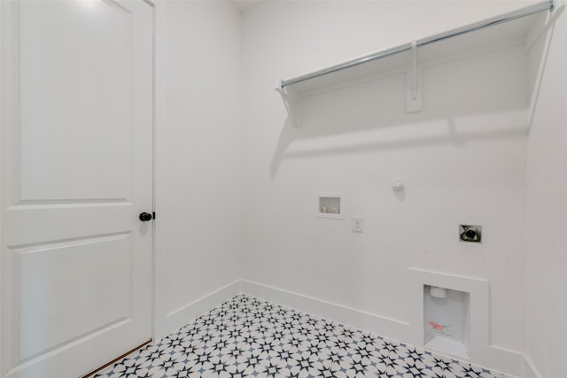 laundry area featuring laundry area, baseboards, tile patterned floors, gas dryer hookup, and electric dryer hookup