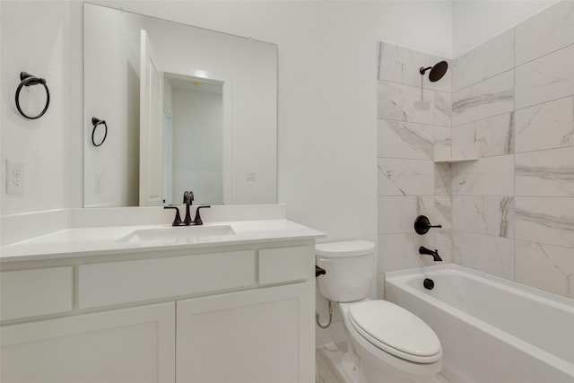 bathroom featuring vanity, shower / bathtub combination, and toilet