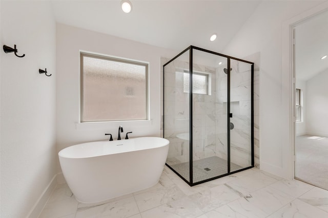 bathroom featuring marble finish floor, a freestanding tub, baseboards, recessed lighting, and a stall shower