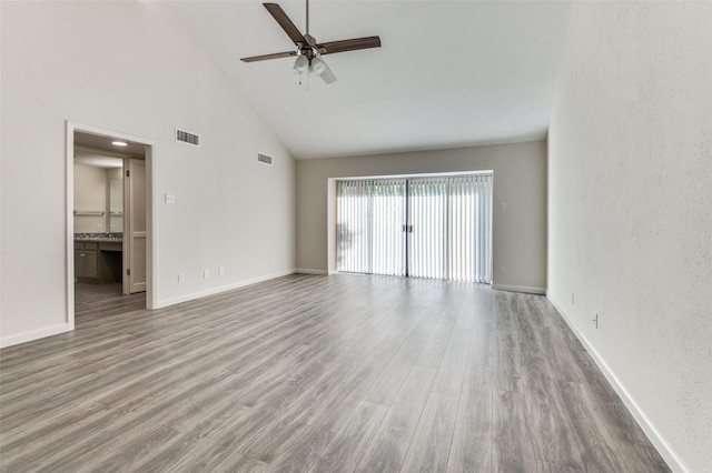 4539 N O Connor Rd Unit 2233, Irving, TX 75062 - unfurnished living room featuring high vaulted ceiling, ceiling fan, wood finished floors, and baseboards