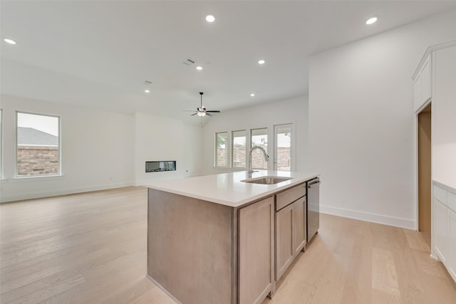 1151 Nora Ln, Forney, TX 75126 - kitchen with a sink, light wood-style flooring, ceiling fan, a kitchen island with sink, and dishwasher