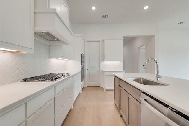 1151 Nora Ln, Forney, TX 75126 - kitchen featuring stainless steel appliances, a sink, light wood finished floors, light countertops, and recessed lighting
