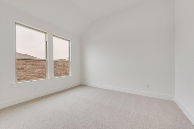 1151 Nora Ln, Forney, TX 75126 - spare room with light colored carpet, lofted ceiling, and baseboards