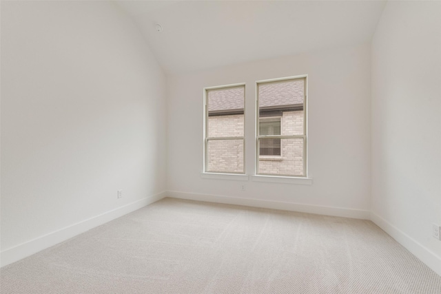 1151 Nora Ln, Forney, TX 75126 - spare room with light colored carpet, baseboards, and lofted ceiling