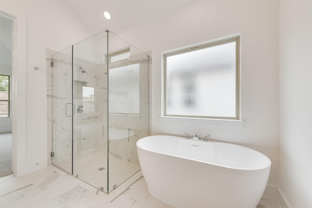 1151 Nora Ln, Forney, TX 75126 - bathroom featuring a freestanding bath, a marble finish shower, marble finish flooring, and baseboards