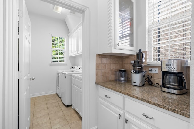1891 Mustang Trl, Frisco, TX 75033 - laundry area with washer and clothes dryer, light tile patterned flooring, and cabinet space