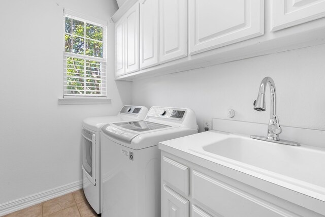 1891 Mustang Trl, Frisco, TX 75033 - laundry room with cabinet space, washer and clothes dryer, and light tile patterned floors