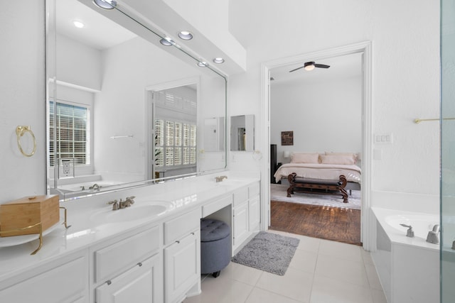 1891 Mustang Trl, Frisco, TX 75033 - ensuite bathroom with double vanity, a bath, tile patterned flooring, and a ceiling fan