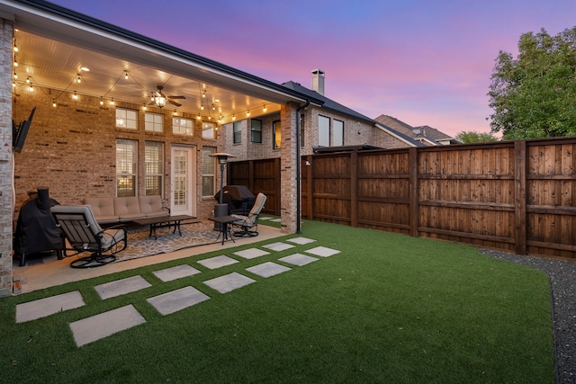 1891 Mustang Trl, Frisco, TX 75033 - yard at dusk featuring a patio and ceiling fan